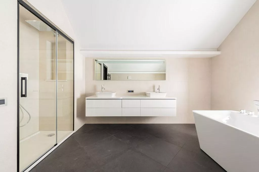luxurious bathroom with glass door shower and white beautiful bathtub